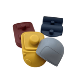 Detail van afneembare onderdelen van siliconen speelset - elk met uniek symbool voor vorm- en kleurenspel.