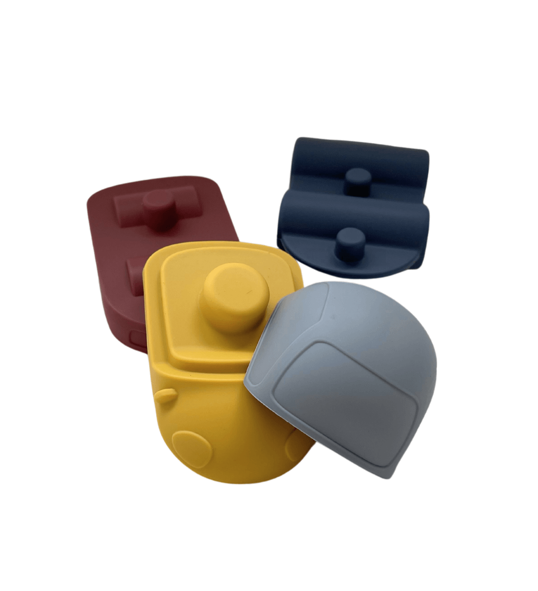 Detail van afneembare onderdelen van siliconen speelset - elk met uniek symbool voor vorm- en kleurenspel.